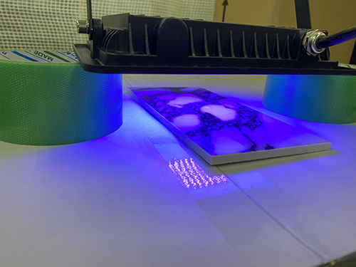 check the contact angle of water droplets with UV light